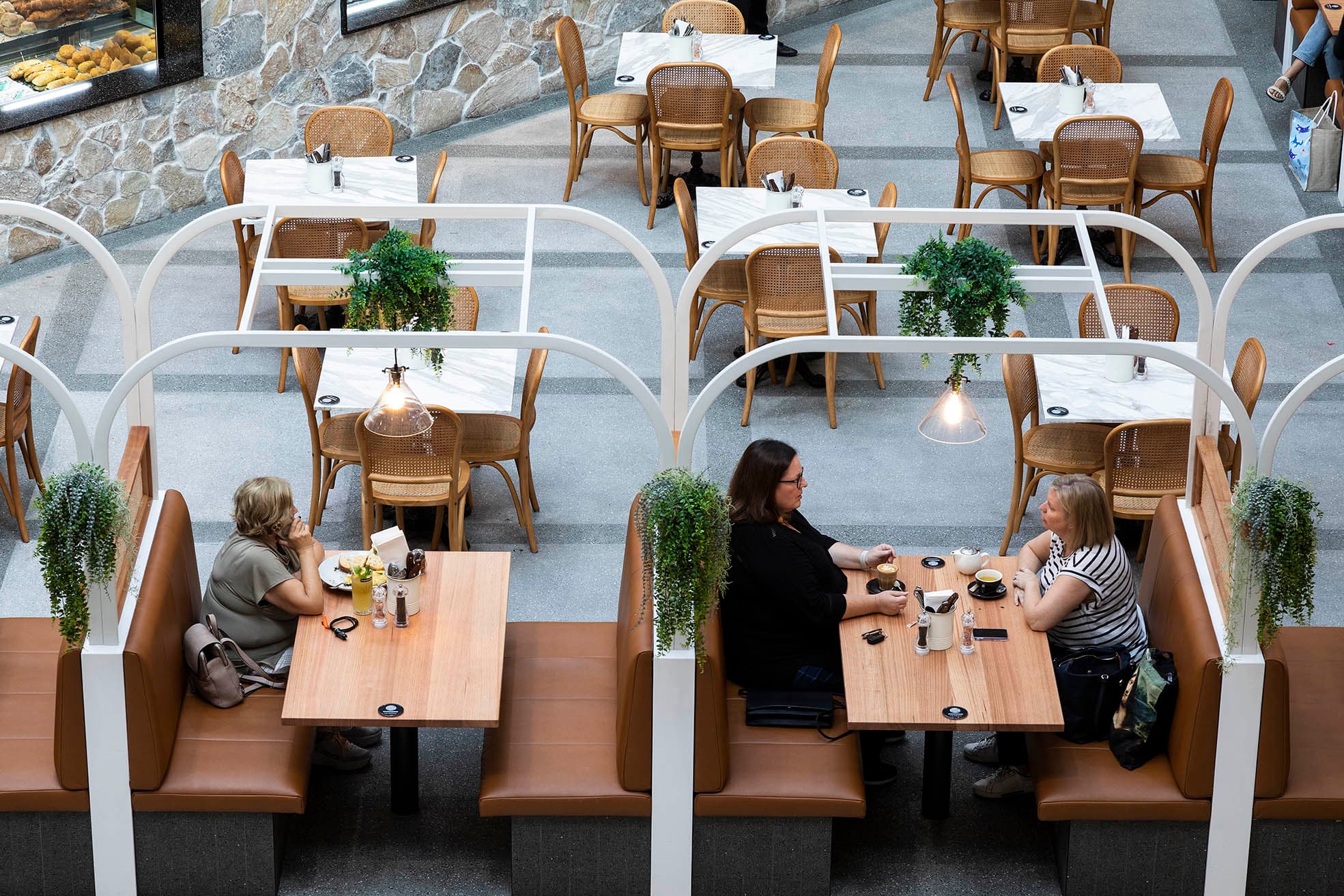 Guests dining at booth tables in Frankie B's Brunch House."