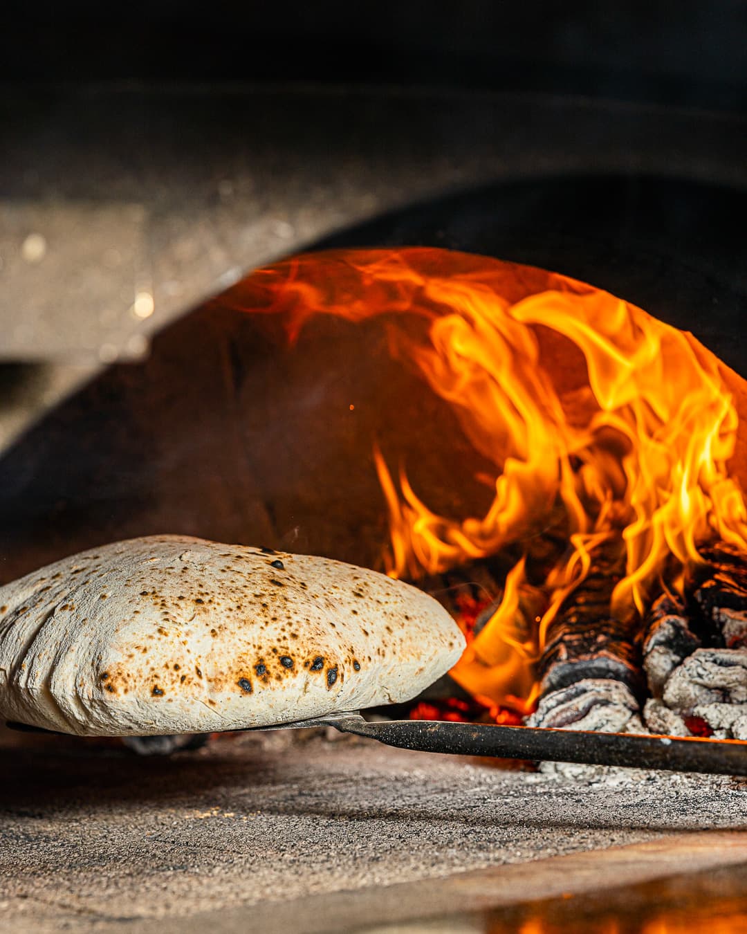 Wood-fired bread baking in a traditional oven