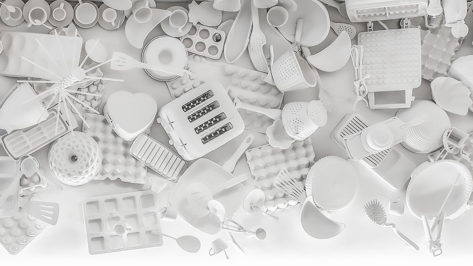 Monochrome wall display with various kitchen utensils at Frankie B's Brunch House.